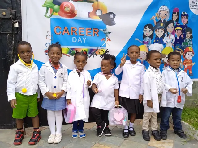 Children in white coats for Career Day
